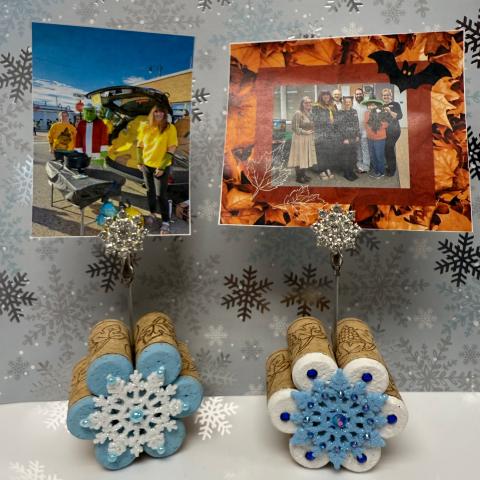 Snowflake frame made out of corks with 2 pictures. 